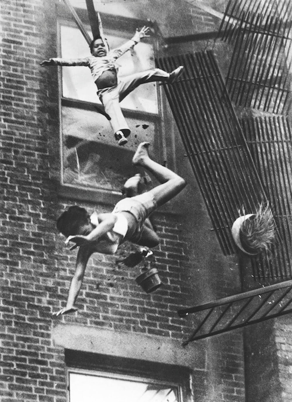a-mother-and-her-daughter-falling-from-a-fire-escape-1975-1